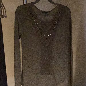 Enhanced with bugle beads and tacks.